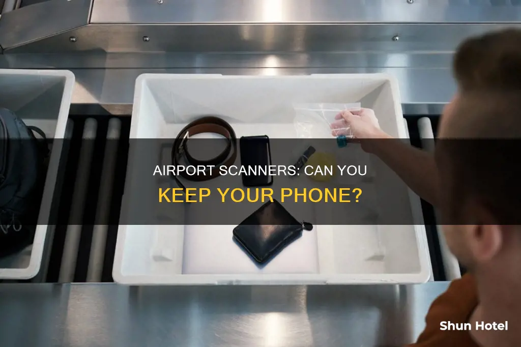 can cell phones go through airport scanners
