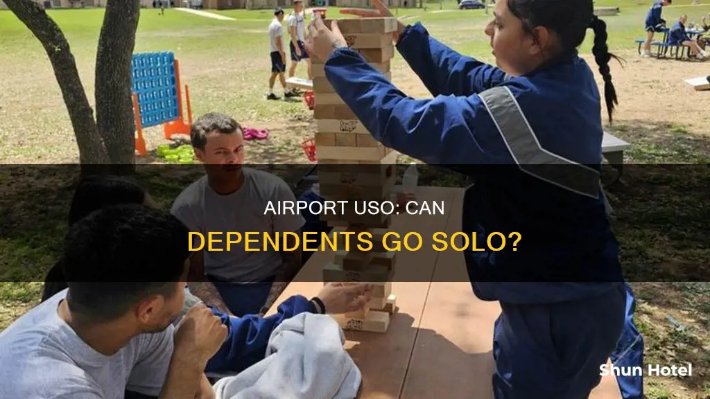 can dependence go to the uso in the airport alone