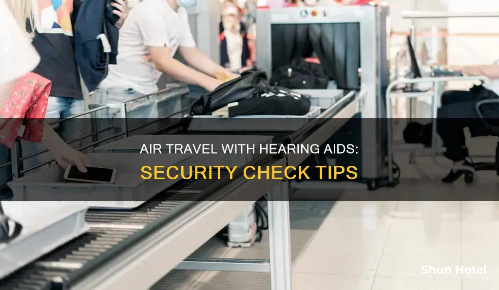 can i go through airport security with hearing aids