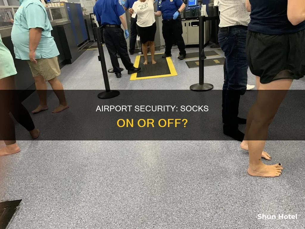 can i leave my socks on at airport