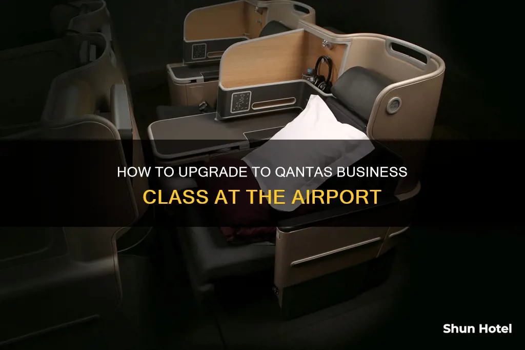 can i upgrade to business class at the airport qantas