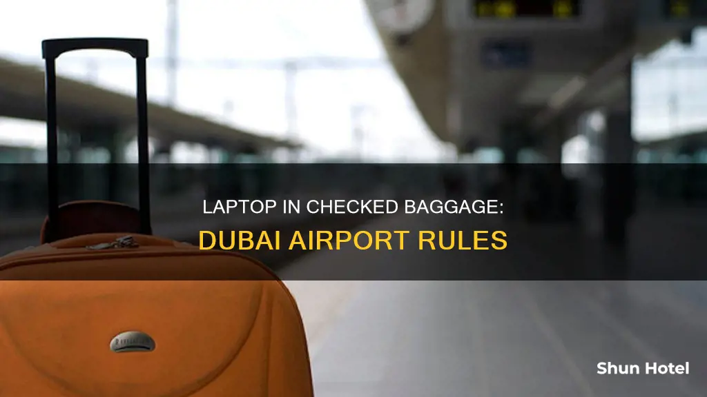 can we put laptop in checked baggage in dubai airport