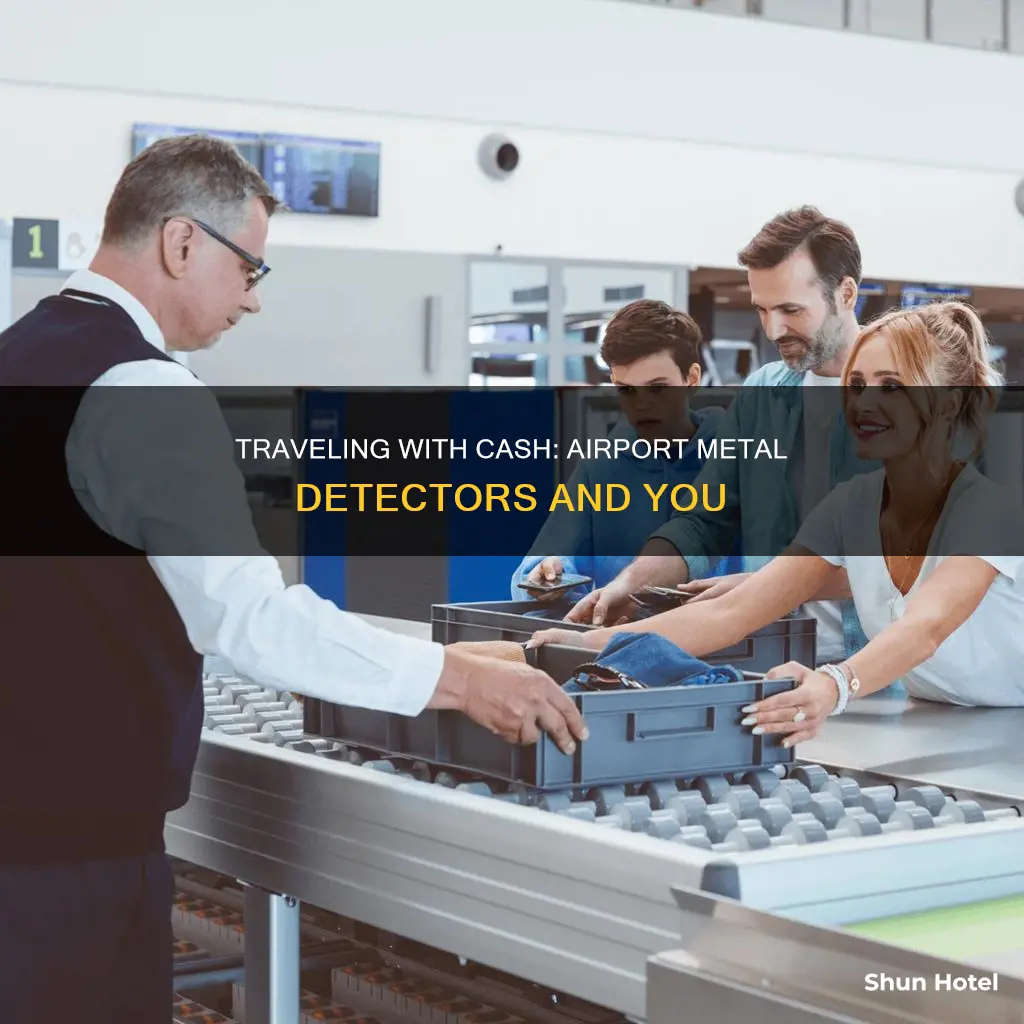 can you carry cash through airport metal detector