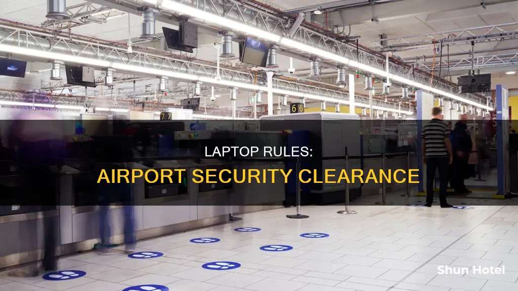 can you go through airport security with your laptop on