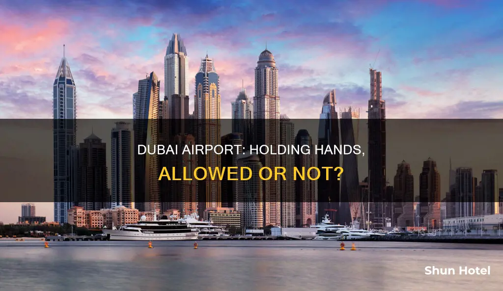 can you hold hands in dubai airport