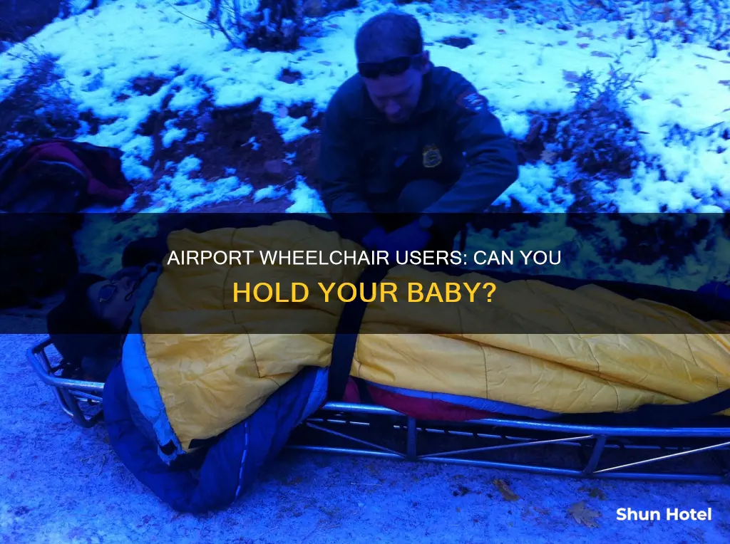 can you take baby in lap in wheelchair in airport