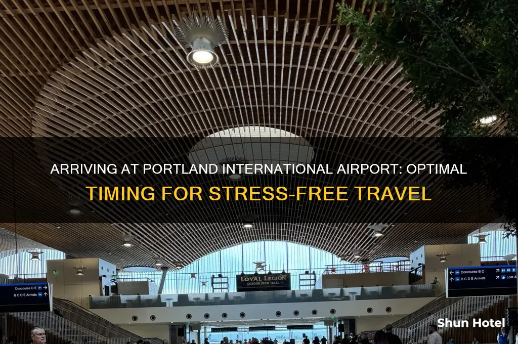 how long should arrive to portland international airport