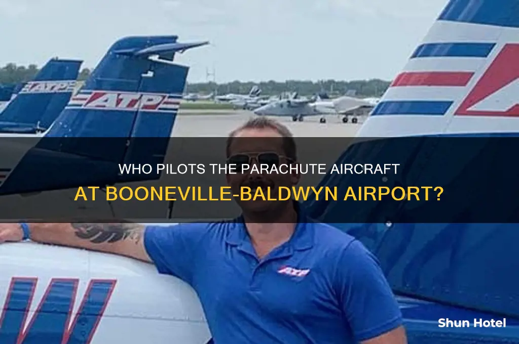 who flies the parachute thing at booneville-baldwyn airport